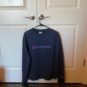 Champion Navy Blue Crewneck. Size says X-Large, but fits like a Men’s Medium.